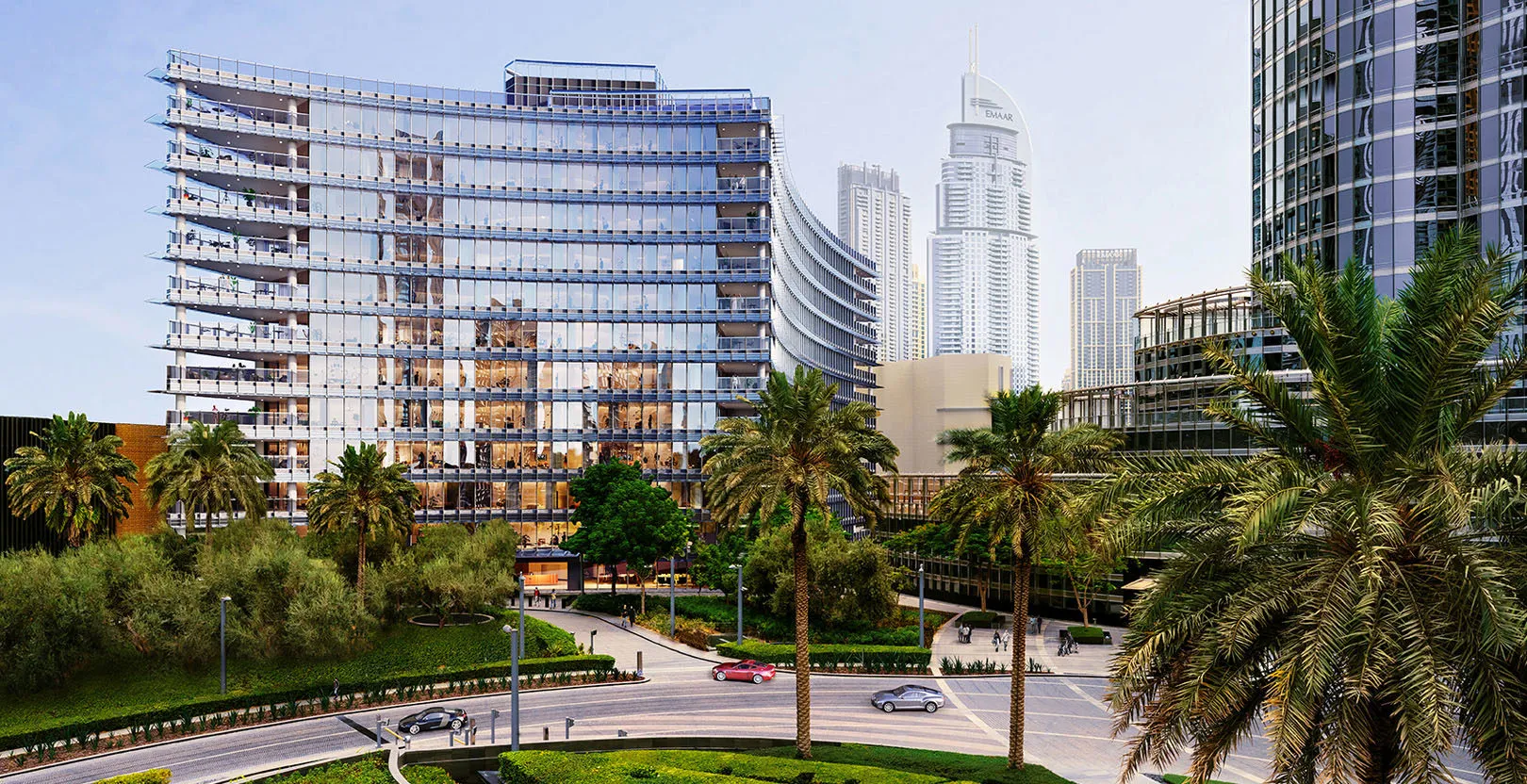 Exterior view of The Residence Burj Khalifa with palm trees and Dubai city skyline