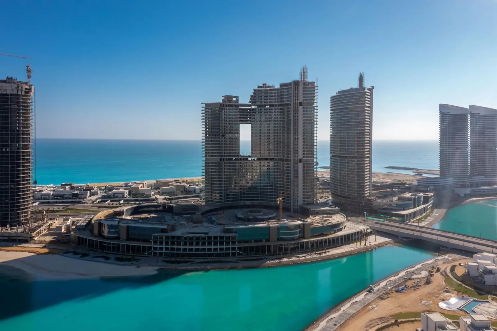 The Gate Towers under construction, with the turquoise sea in the background, home to the Comelit video intercom system.